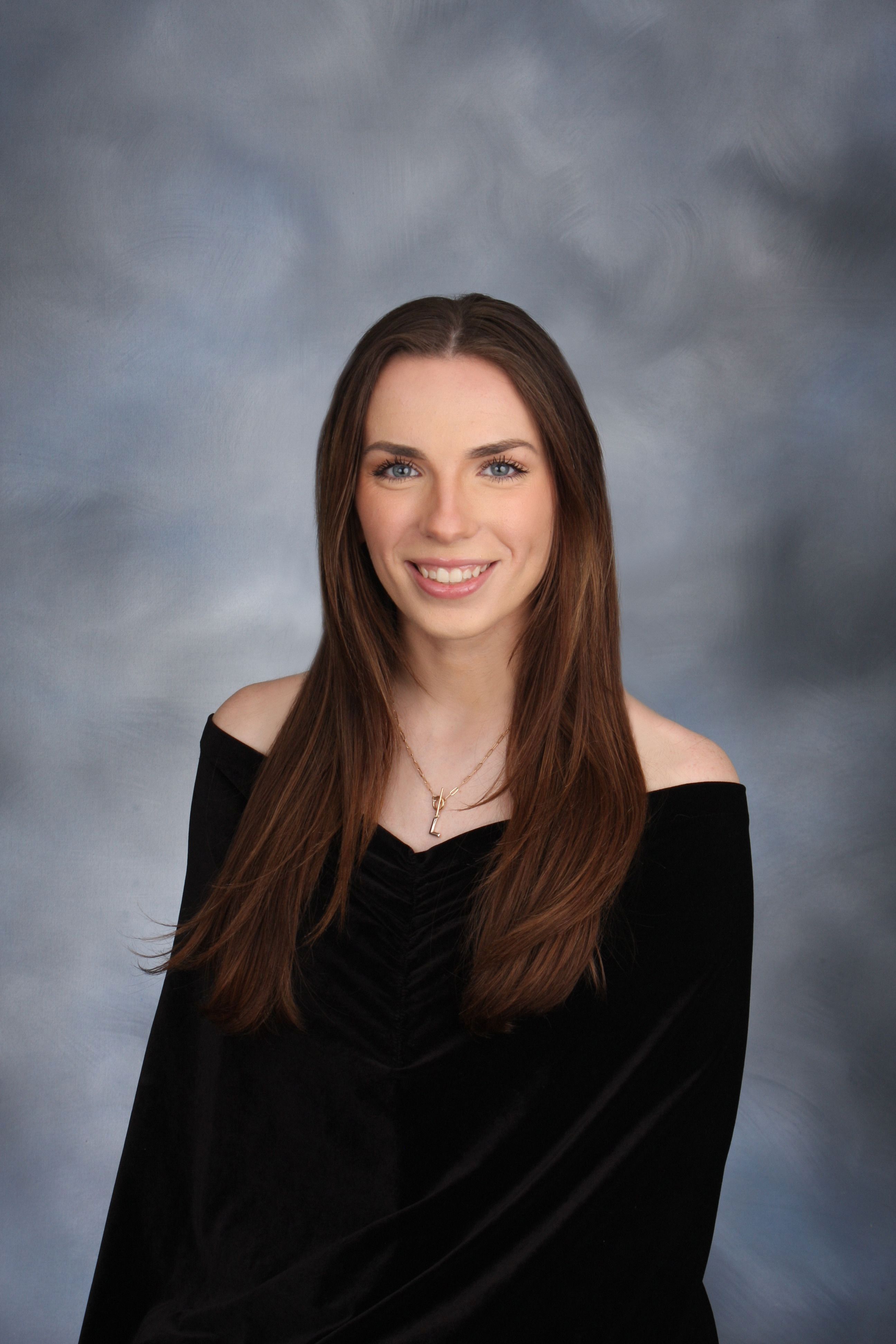 An image of Lauren Scriba smiling in a black blouse.