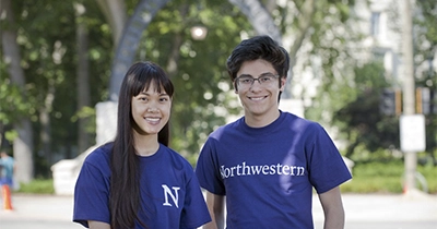 female and male student smiling
