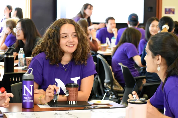 Learning Sciences student Chelsi Miller discusses an activity at new student orientation.