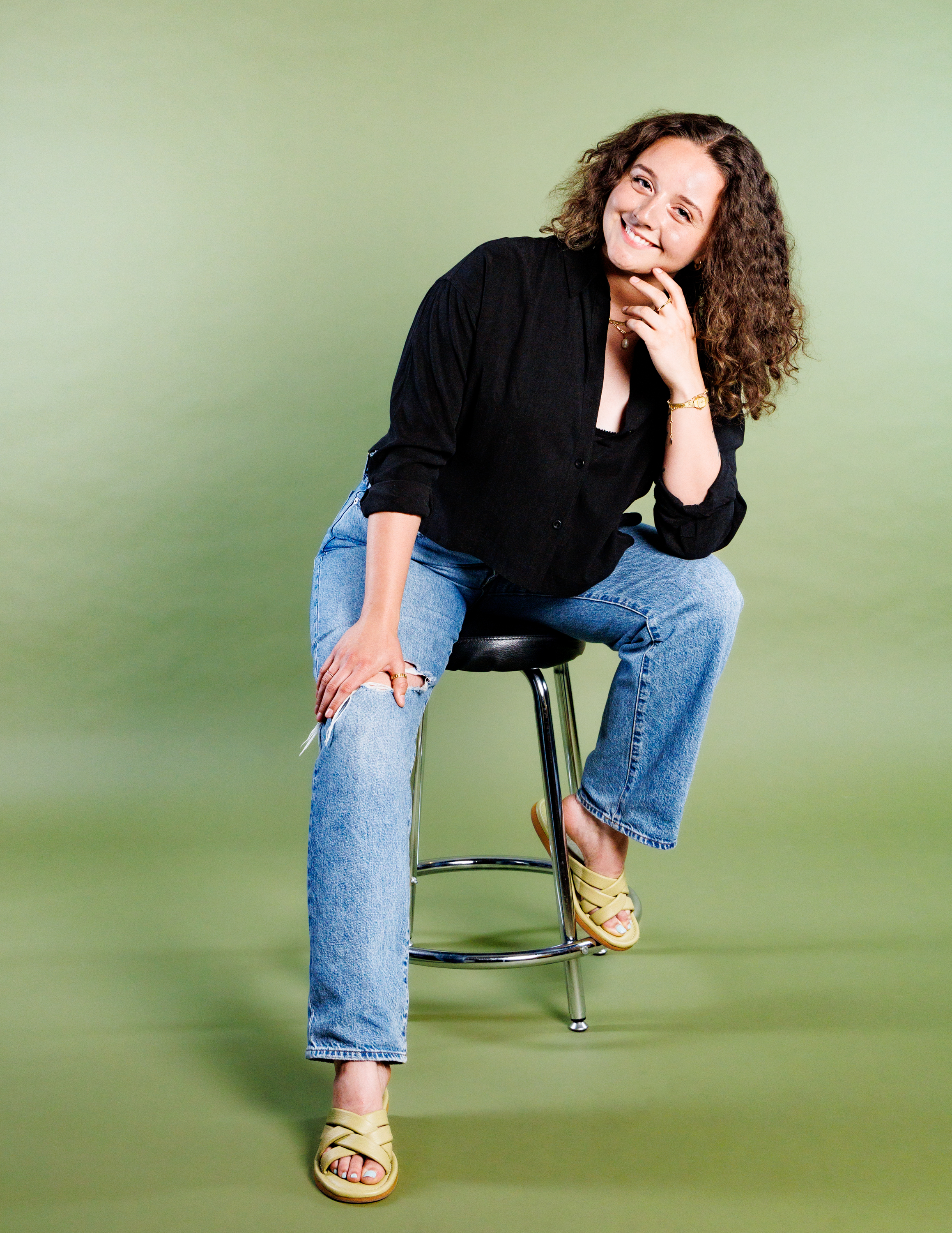 An image of Chelsi Miller, seated, smiling at the camera.