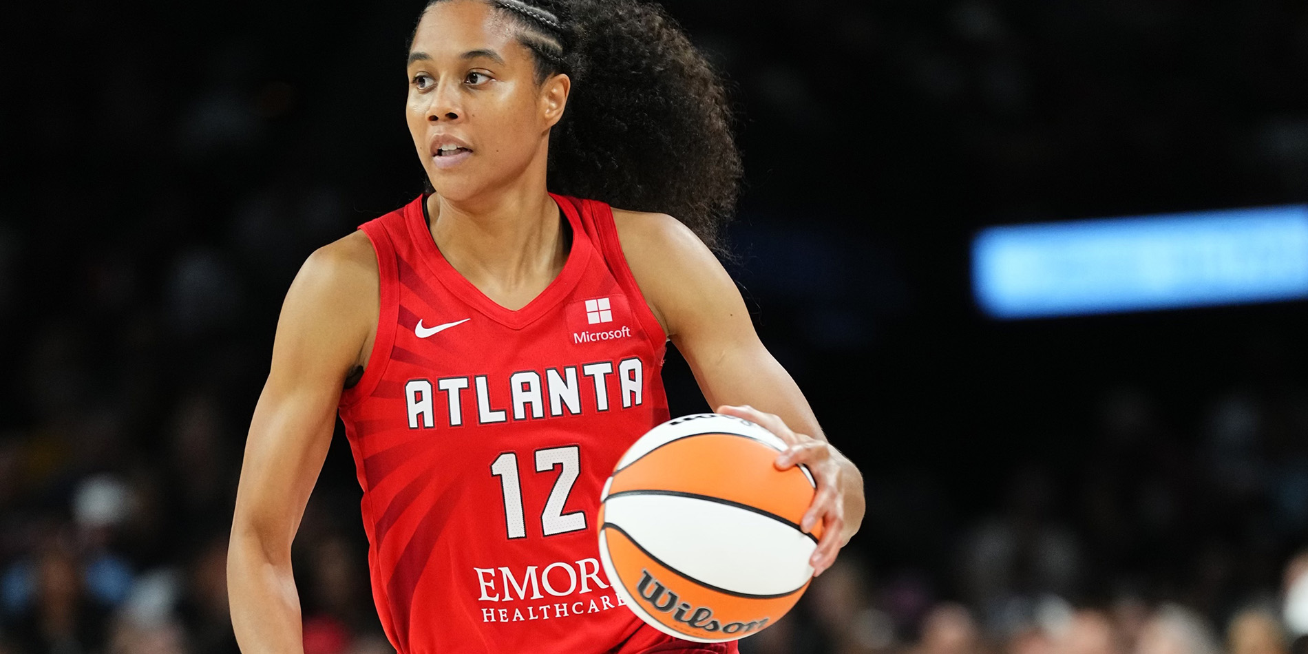 Nia Coffy dribbling a basketball