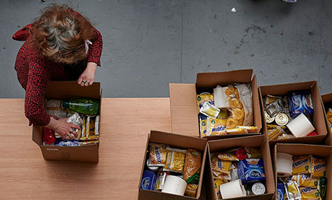 person packing food box