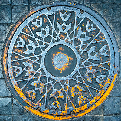 sewer cover with geometric pattern